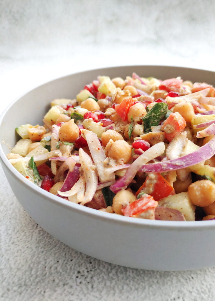 chickpea veggie salad in a bowl side view