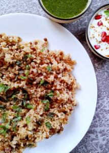 one pot lentil rice in a plate with mint chutney and raita