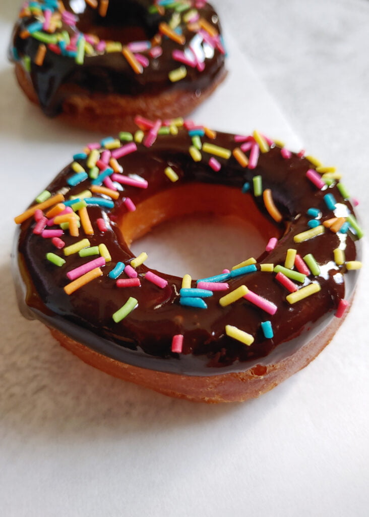 chocolate eggless donut with rainbow sprinkles