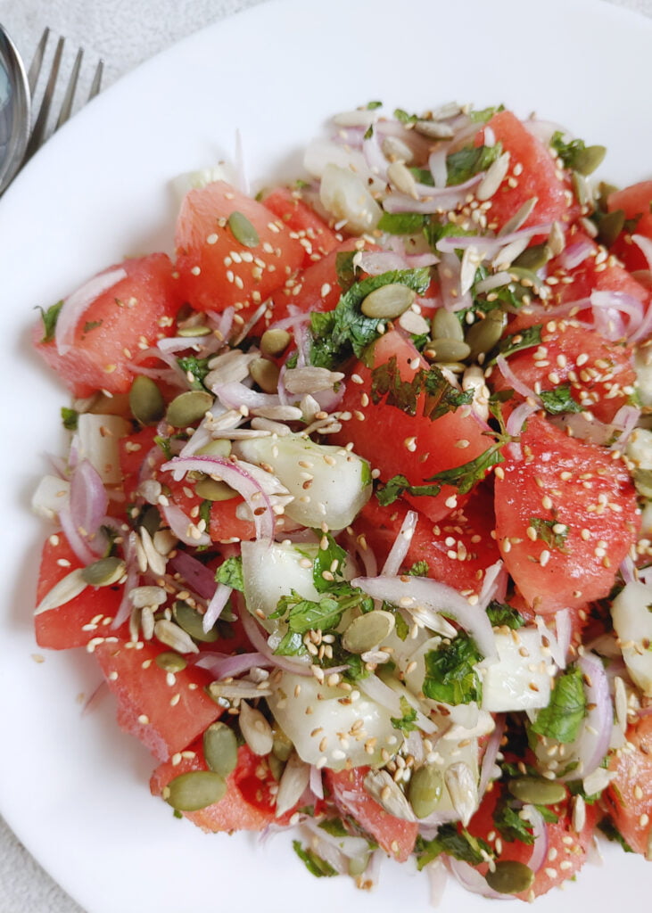 watermelon cucumber salad in a plate - photo taken from close_1