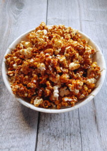 caramel coated popcorn served in a bowl