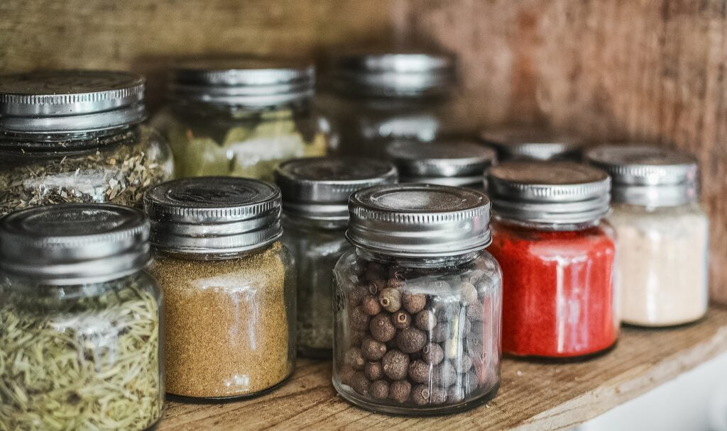 How to Store Spices - Spice Bottles on Shelf
