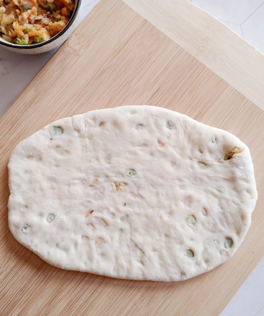 amritsari kulcha rolled in roti shape before cooking