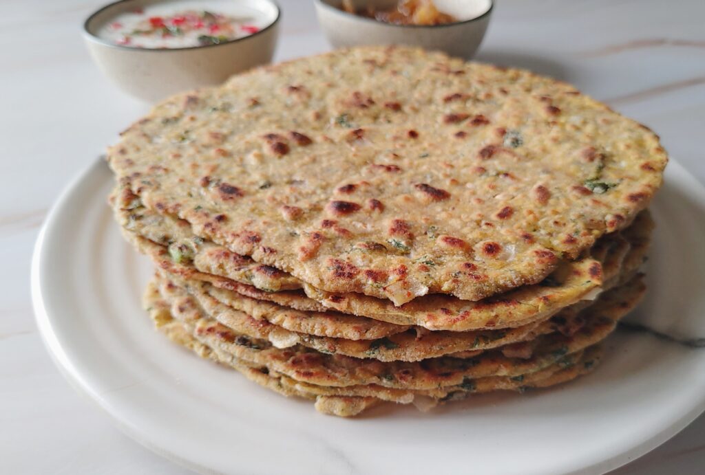 methi parathas stacked in a plate