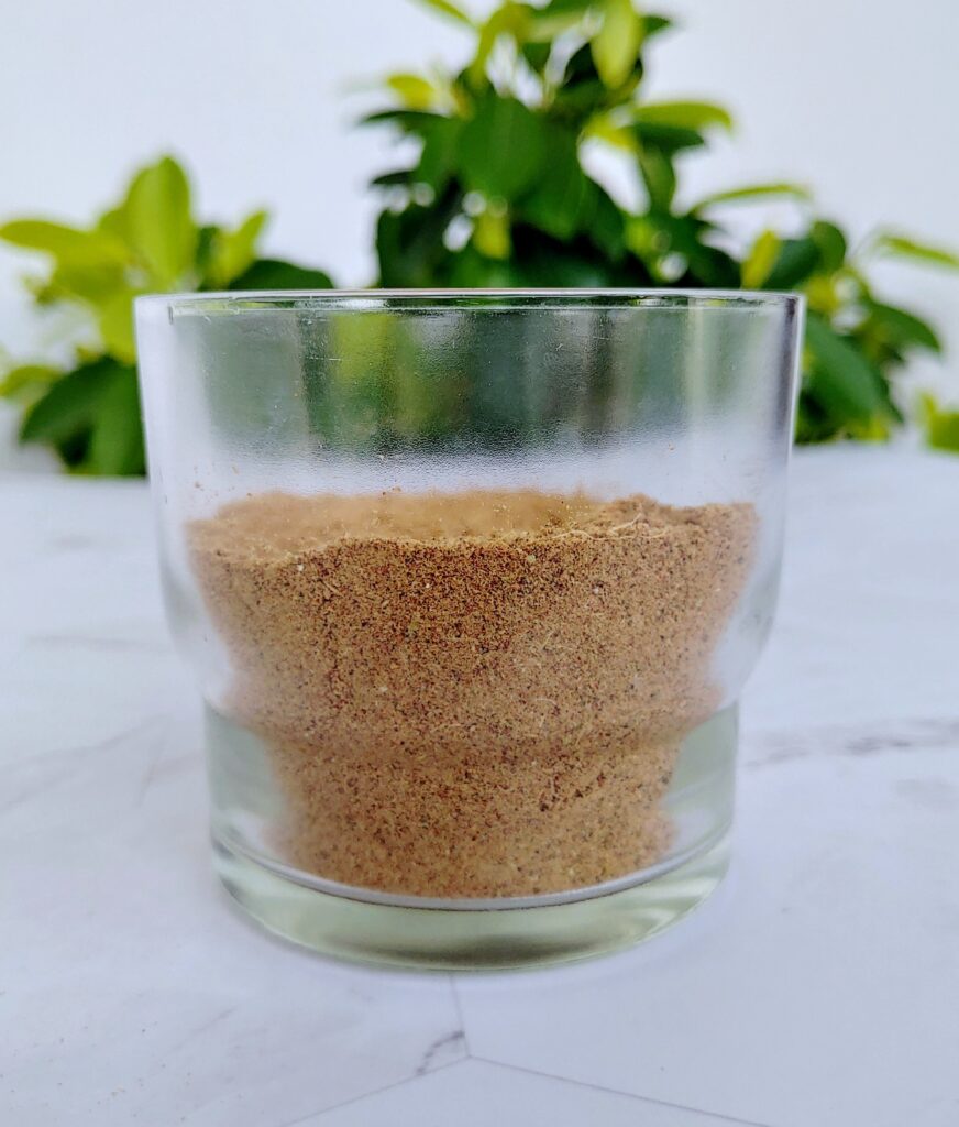 chai spice mix powder in a glass jar
