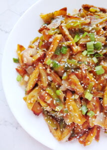honey chilli potatoes served in a plate