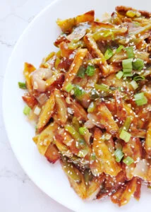 honey chilli potatoes served in a plate