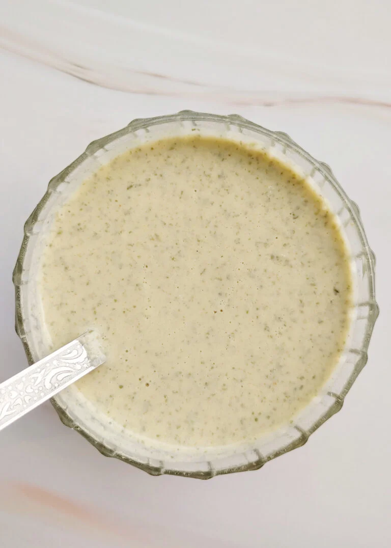 featured image oil - free roasted pumpkin seed dressing served in a glass bowl