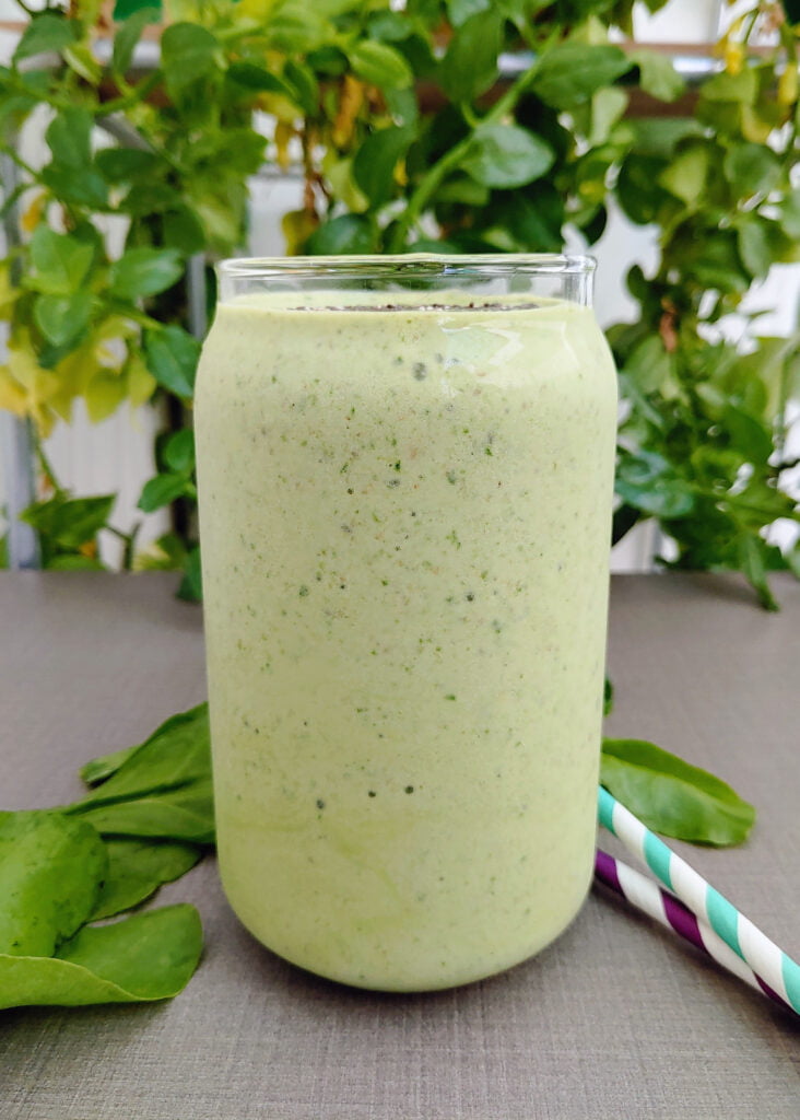 green smoothie poured in a glass