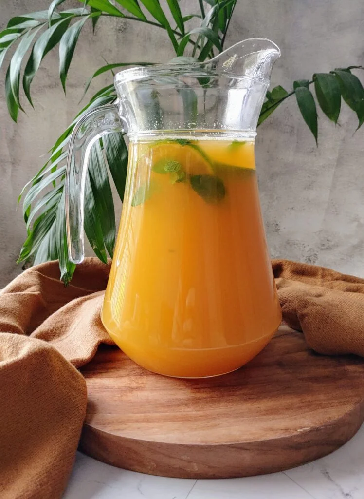 orange lemon iced green tea in a glass jug