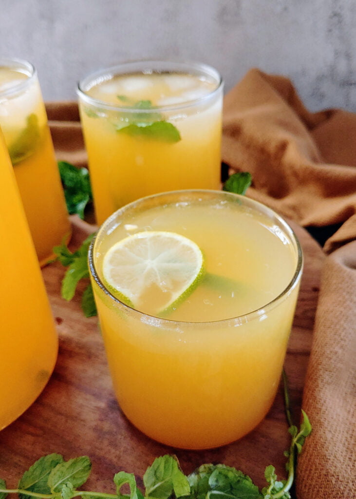 orange lemon iced green tea poured into glasses