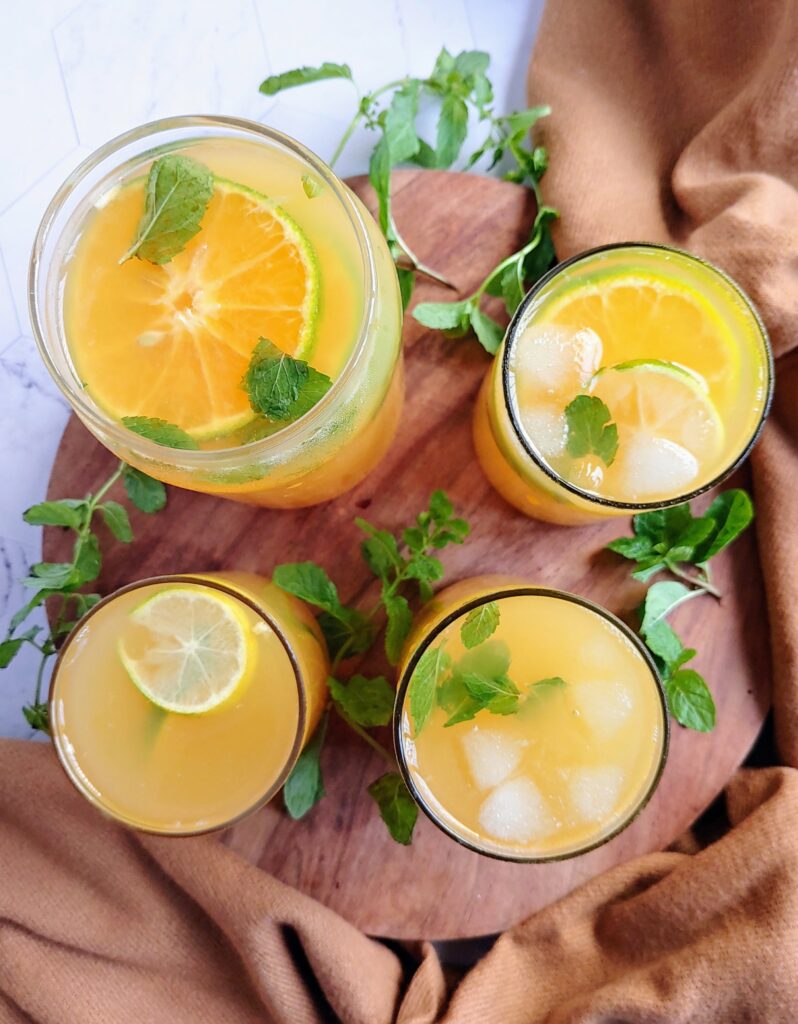 orange lemon iced green tea poured into glasses photo taken from top