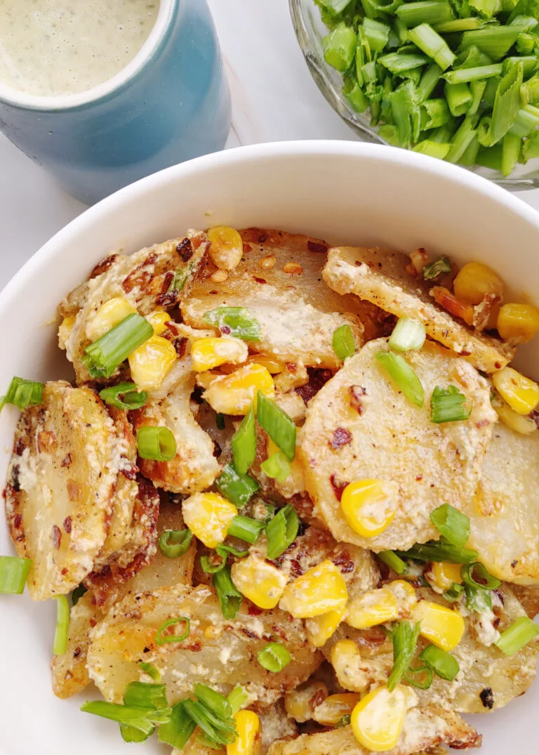 Roasted Potato and Corn Salad in Pumpkin Seed Dressing Served in a Bowl