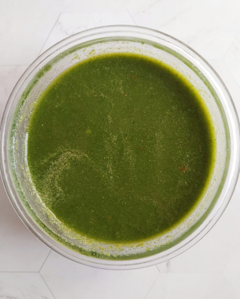 photo taken from top of mint coriander chutney served in a bowl