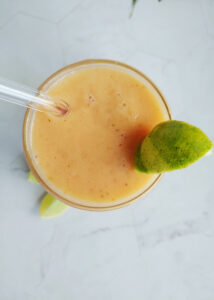 photo taken from top of papaya smoothie in a glass