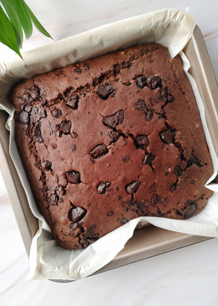 baked vegan brownie in a baking tray