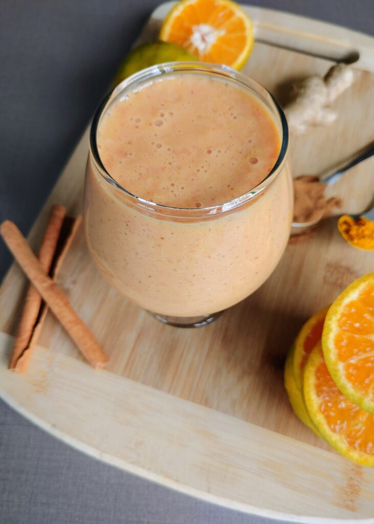 orange smoothie in a glass