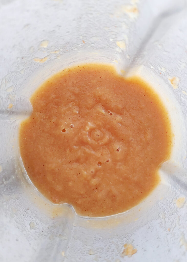 pureed apples and dates in a blender
