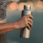 Person Holding Stainless Steel Vacuum Flask