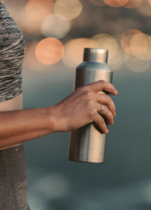 Person Holding Stainless Steel Vacuum Flask