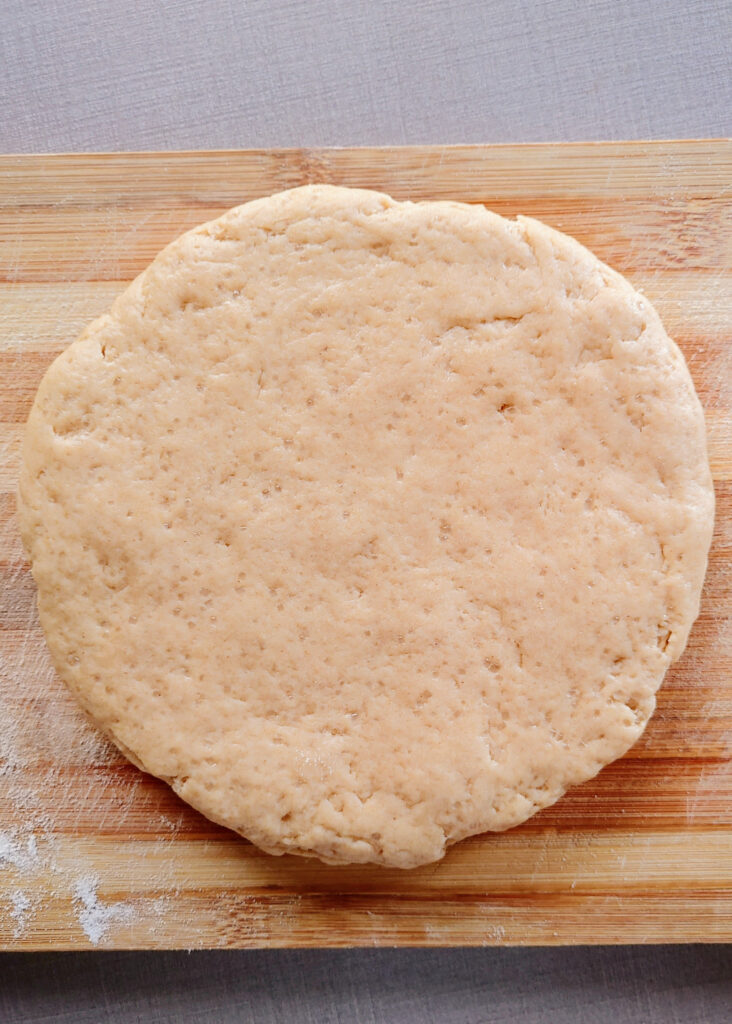 egg-free whole-wheat scones rolled out dough on a wooden surface
