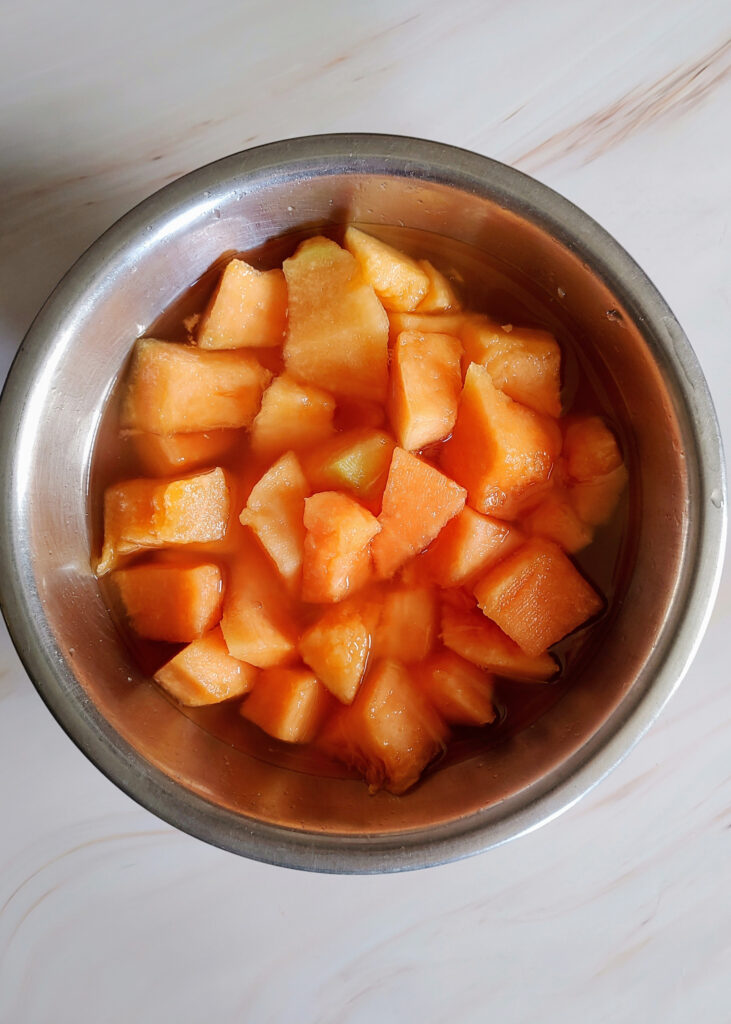 melon and other ingredients mixed in a bowl after macerate