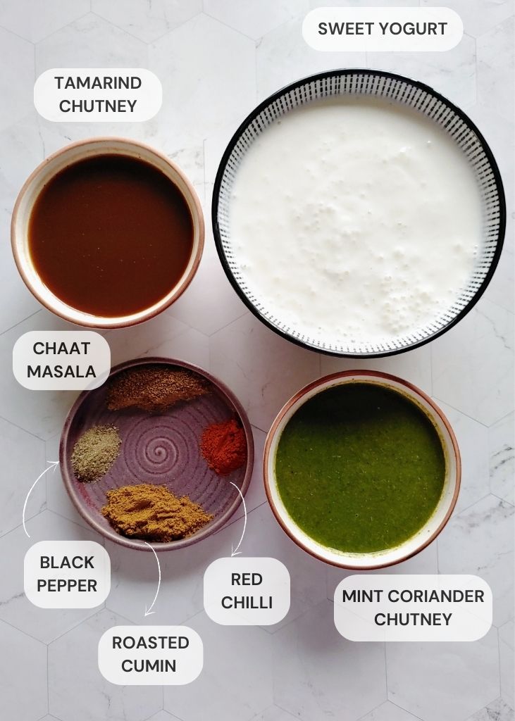sweet curd, chutneys, and spices in bowls