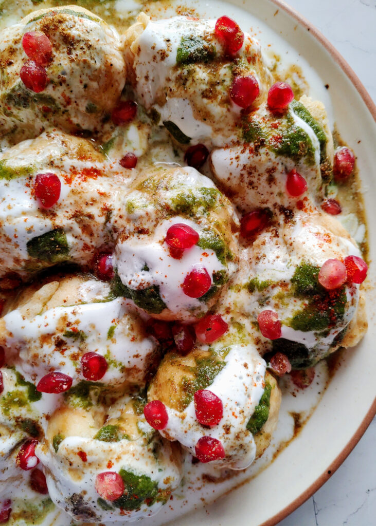 zoomed in dahi bhalle served in a plate
