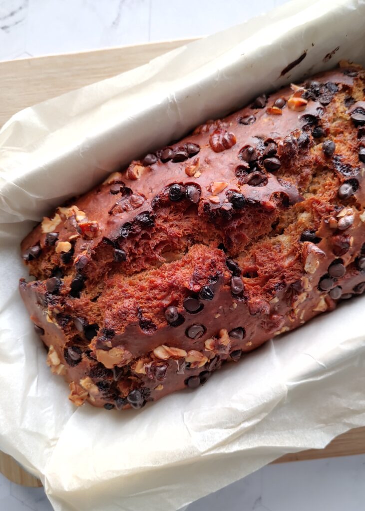 close up photo of eggless chocolate chip walnut banana bread loaf