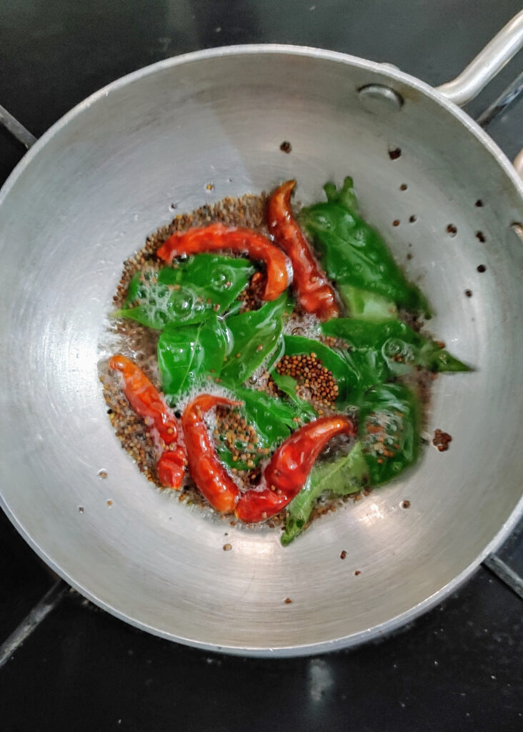 tempering for coconut mint chutney in a frying pan