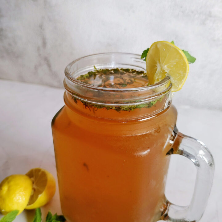 mint lemon iced tea served in a glass jar