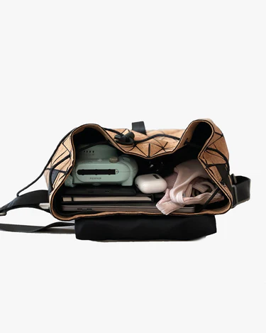 cork backpack with books and accessories inside by shakti warrior