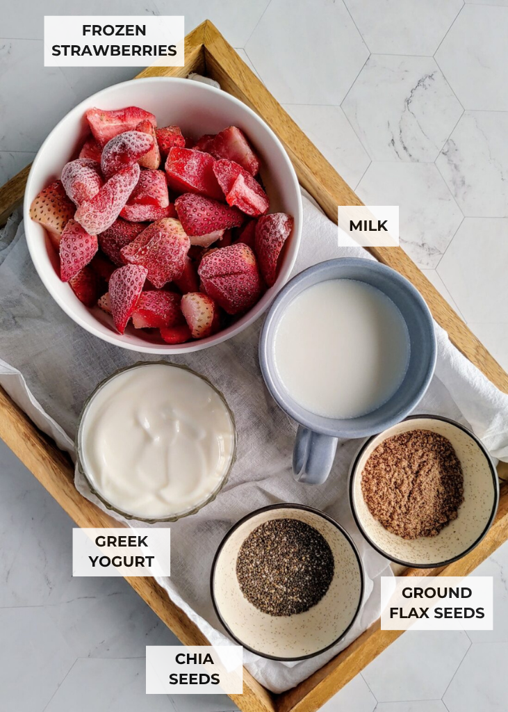 ingredients for strawberry smoothie in a tray